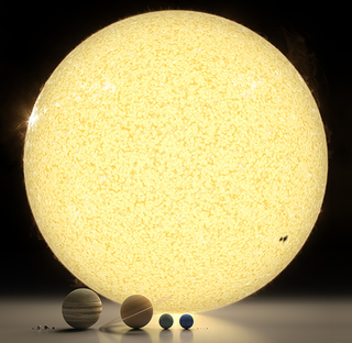 Illustration for article titled El diminuto tamaño de Encélado frente a la inmensidad de Saturno